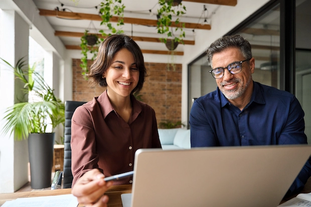 two-happy-busy-male-and-female-business-people